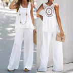 Lifestyle shot of the white lace top and wide-leg pants set, showcasing the chic design and stylish look.