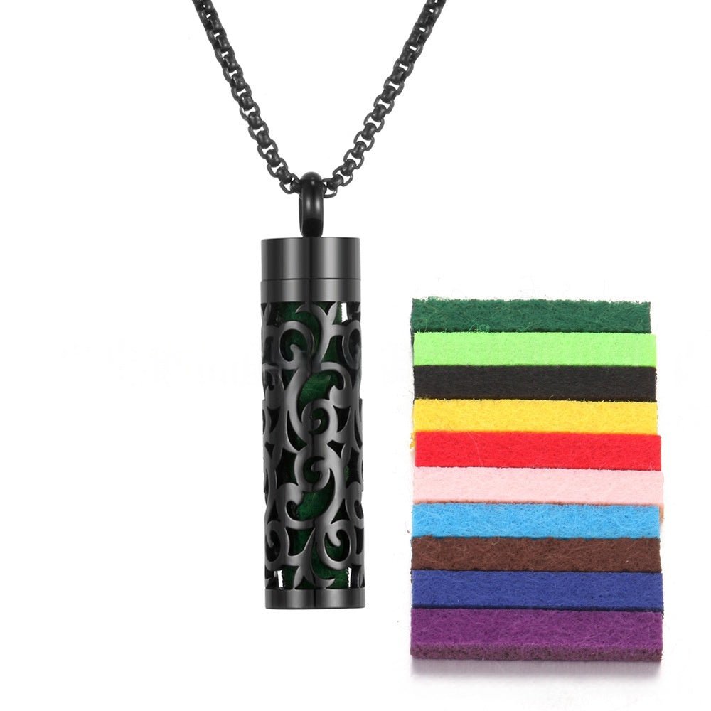Detail close-up of the stainless steel pendant in black and silver with a necklace chain.