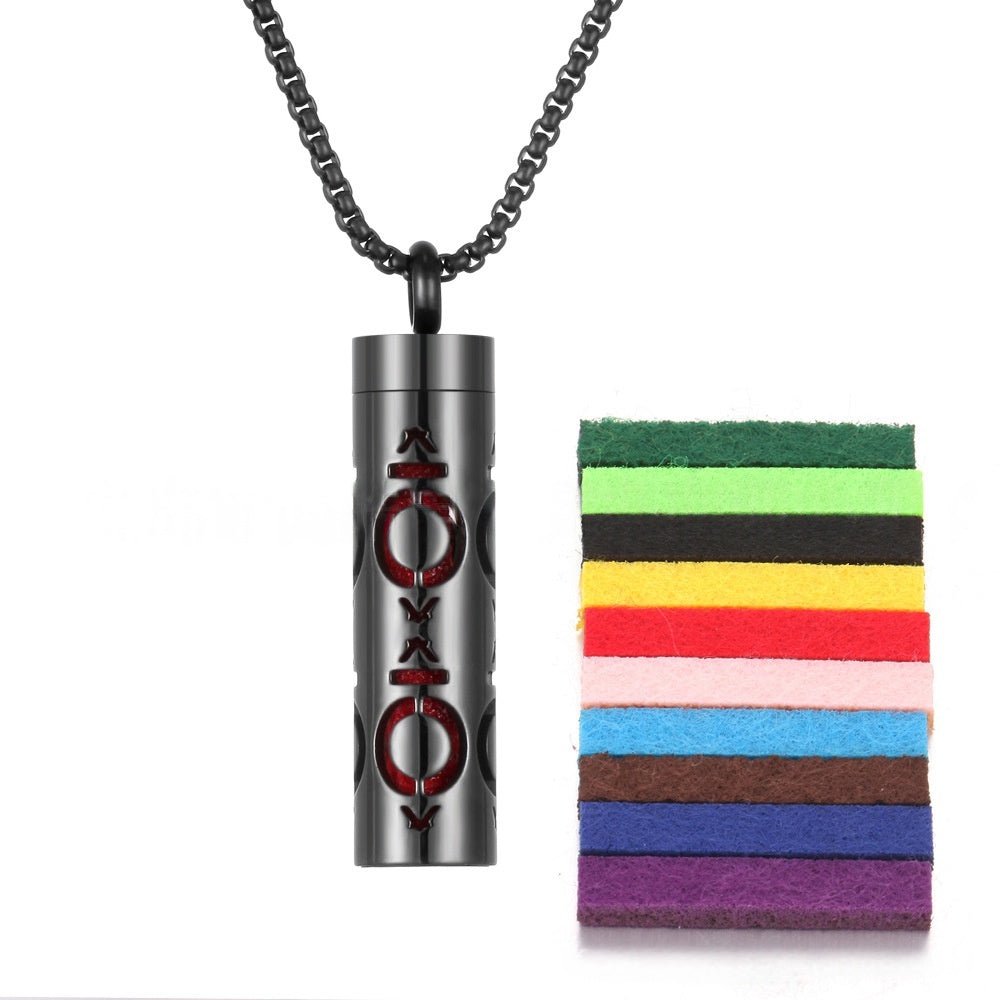 Detail close-up of the aromatherapy pendant in black and yellow featuring a stainless steel essential oil bottle.
