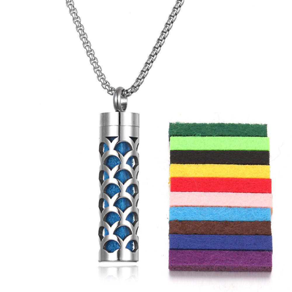 Detail close-up of the stainless steel pendant featuring a bottle design and chain included in silver and blue.