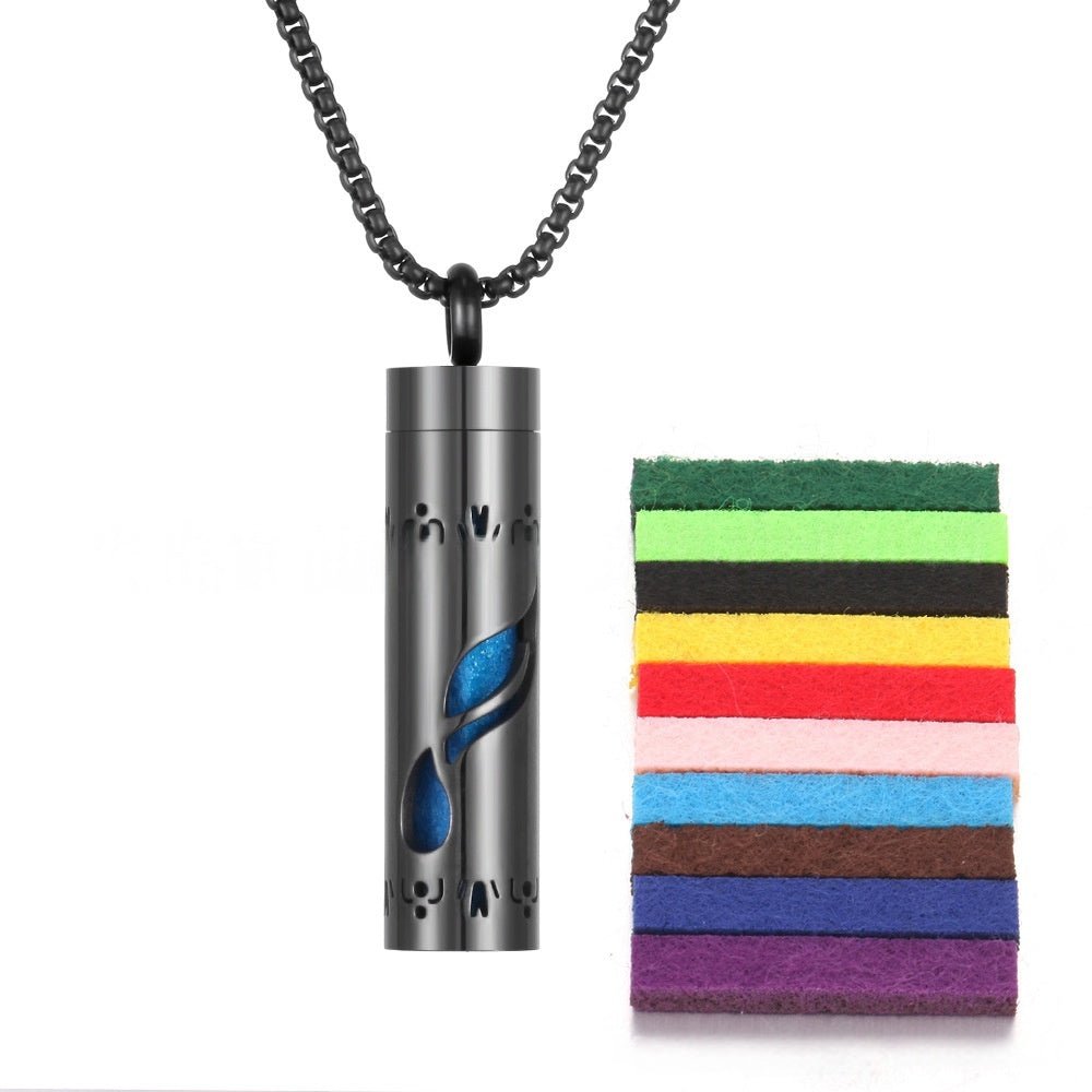 Close-up detail of blue stainless steel aromatherapy pendant with chain necklace.