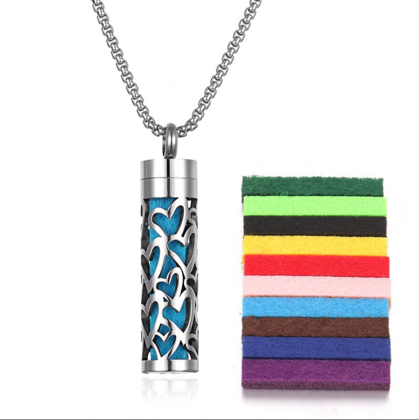 Detail close-up of the long stainless steel pendant in blue.