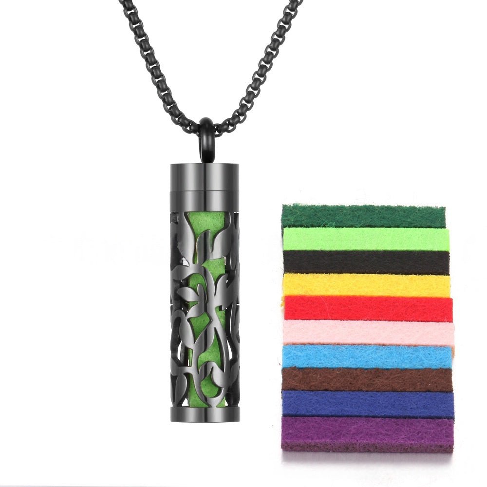 Detail close-up of the stainless steel pendant with a black and silver color scheme.
