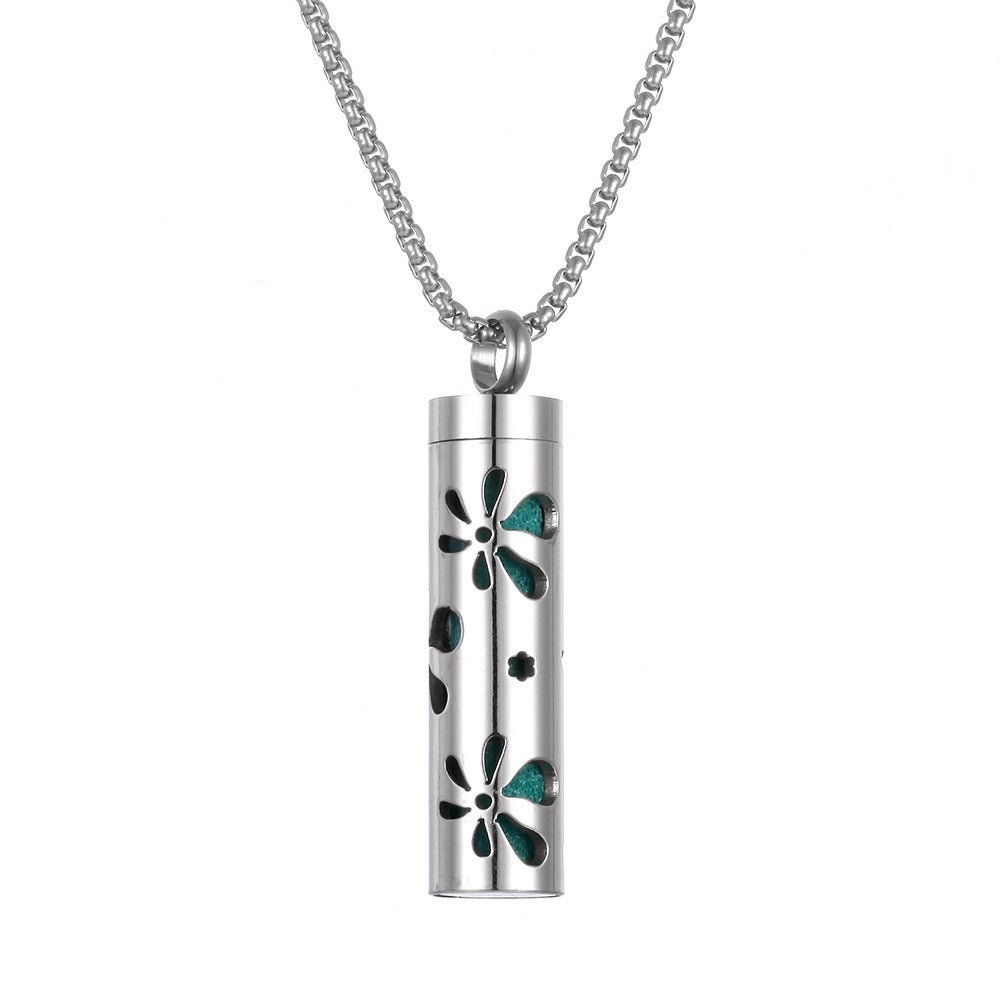 Stainless steel aromatherapy pendant in silver and teal with a long chain.