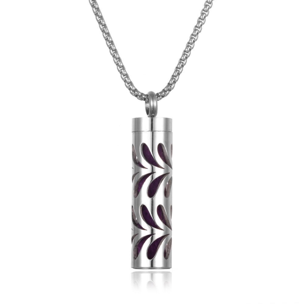 Detail close-up of the stainless steel pendant featuring a silver and red design.
