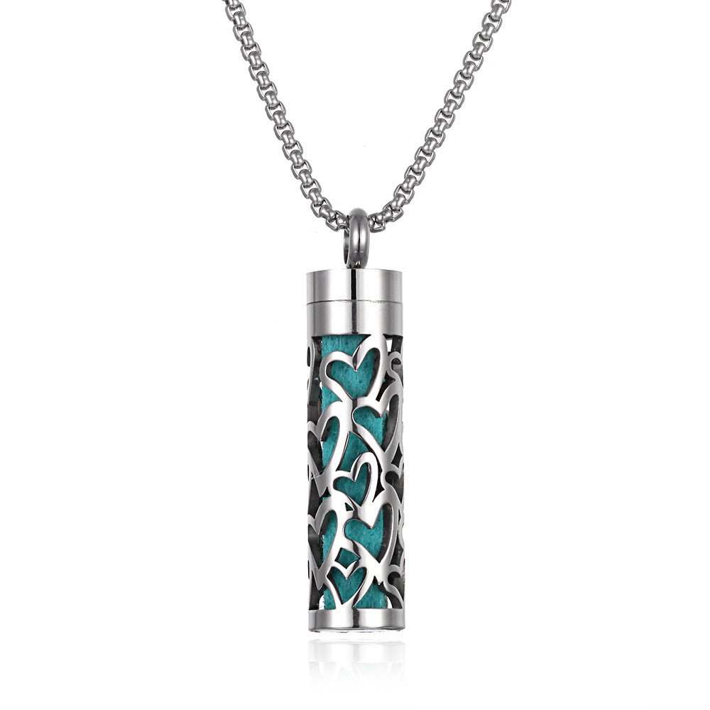 Detail close-up of the long stainless steel pendant featuring turquoise.
