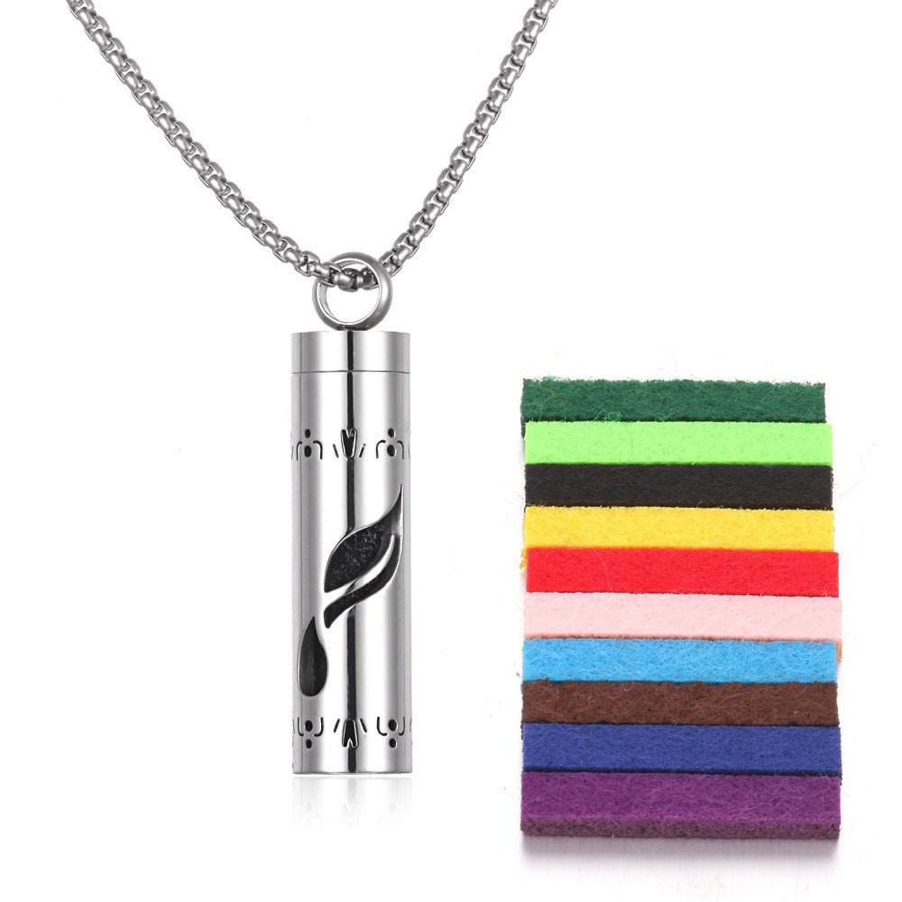 Detail close-up of the stainless steel pendant with a leaf design and colorful pads in silver and multicolor.