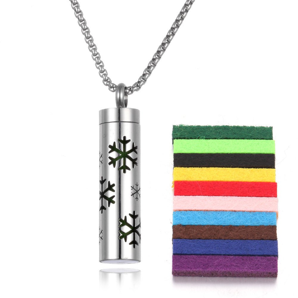 Silver stainless steel aromatherapy pendant with chain necklace, lifestyle shot.