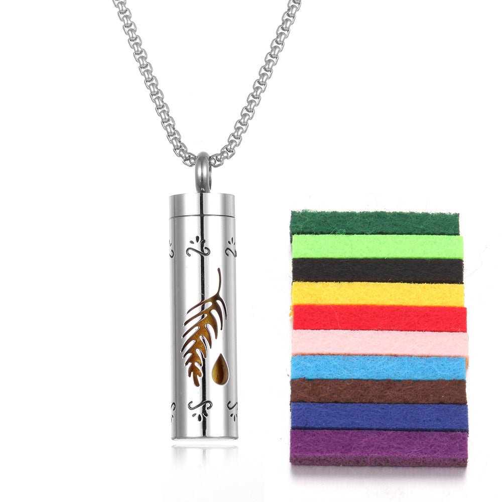 Brown stainless steel aromatherapy pendant with chain necklace, lifestyle shot.