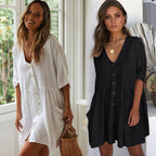 Lifestyle shot of white and black beach blouses with button front and loose fit, versatile for chic fashion looks.