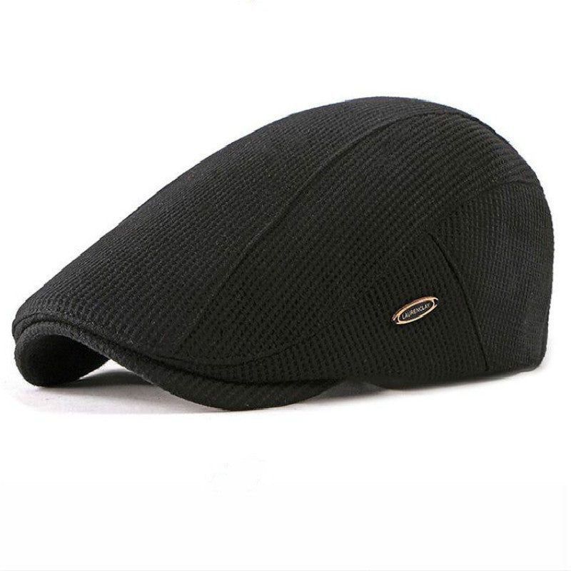 Side view of the black wool beret hat featuring a retro style, showcasing its knitted texture against a white background.