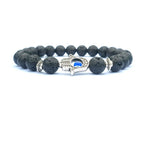 Detail close-up of the black stone bracelet showcasing its elegant beaded design and evil eye charm.