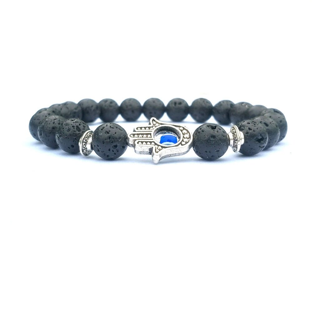 Detail close-up of the black stone bracelet showcasing its elegant beaded design and evil eye charm.