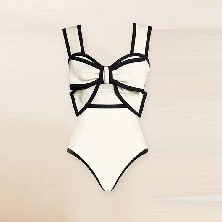 One-Piece Dots Bikini Suit in black and white with bow detail, front view.