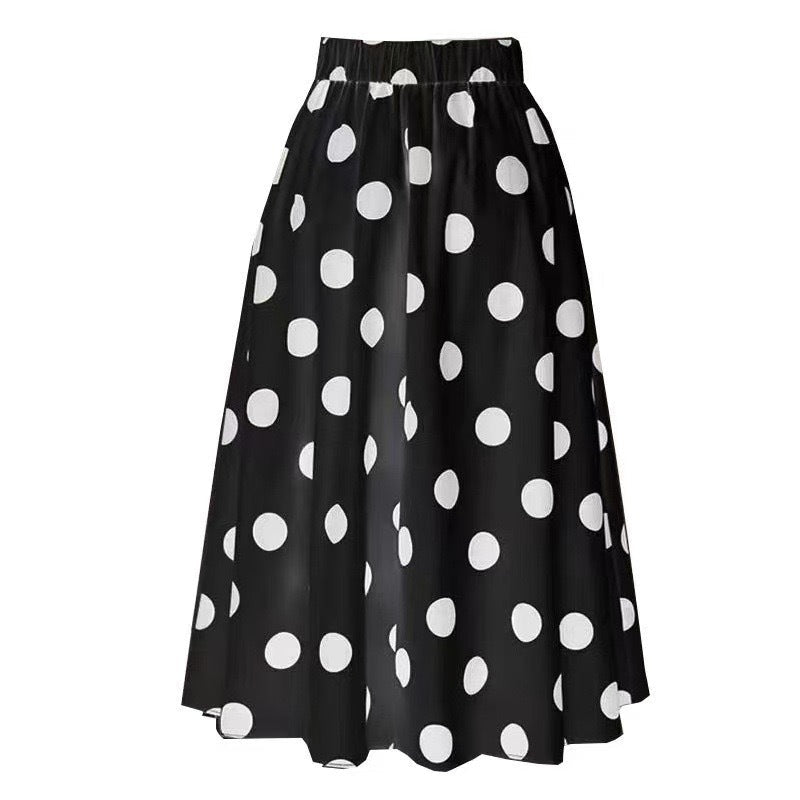 Lifestyle view of One-Piece Dots Bikini Suit with strappy design and polka dot skirt.