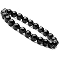 Black onyx bracelet worn on wrist, featuring smooth beads in a chic style