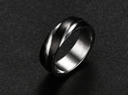 Detail view of the black titanium steel ring featuring a polished surface against a black background.