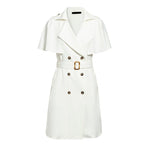 Detail shot of a white dress with double-breasted features, styled for chic casual occasions.