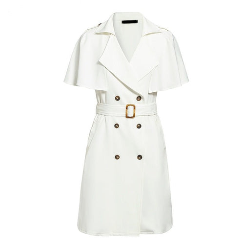 Detail shot of a white dress with double-breasted features, styled for chic casual occasions.