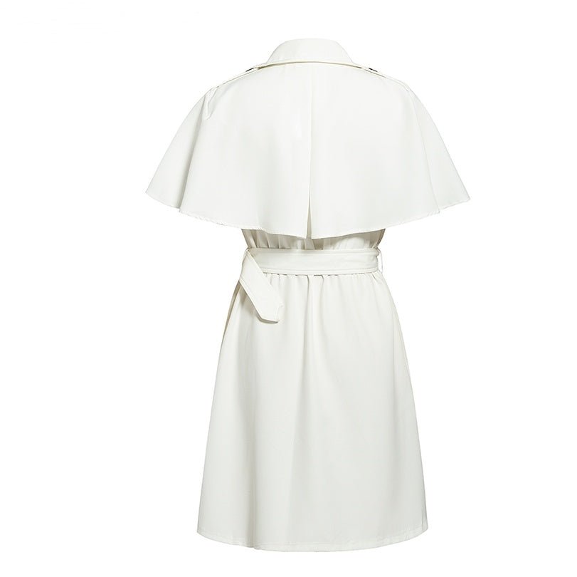Back view of a white dress with cape sleeves and belted waist, highlighting sophisticated design.