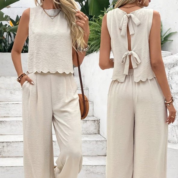 Back view of apricot casual sleeveless vest and trousers set, featuring a stylish tie detail.