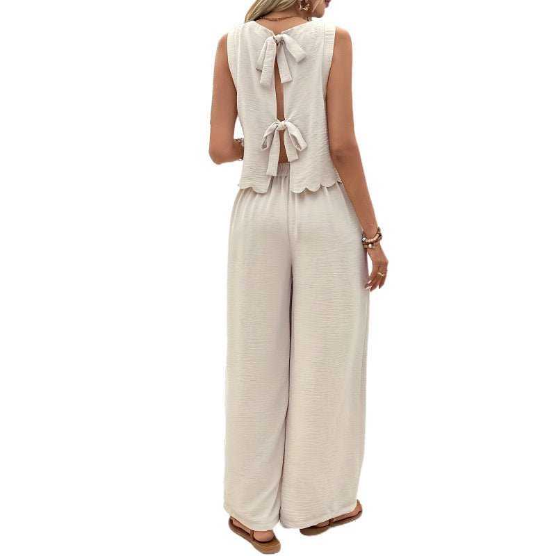 Back view of apricot casual sleeveless vest and trousers set featuring an open back design.