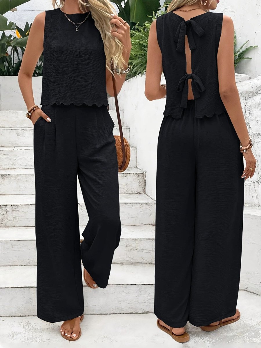 Lifestyle view showcasing apricot and black casual sleeveless vest and trousers set with back tie detail.