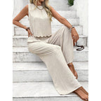 Back view of black casual sleeveless vest and trousers set highlighting the tie detail.