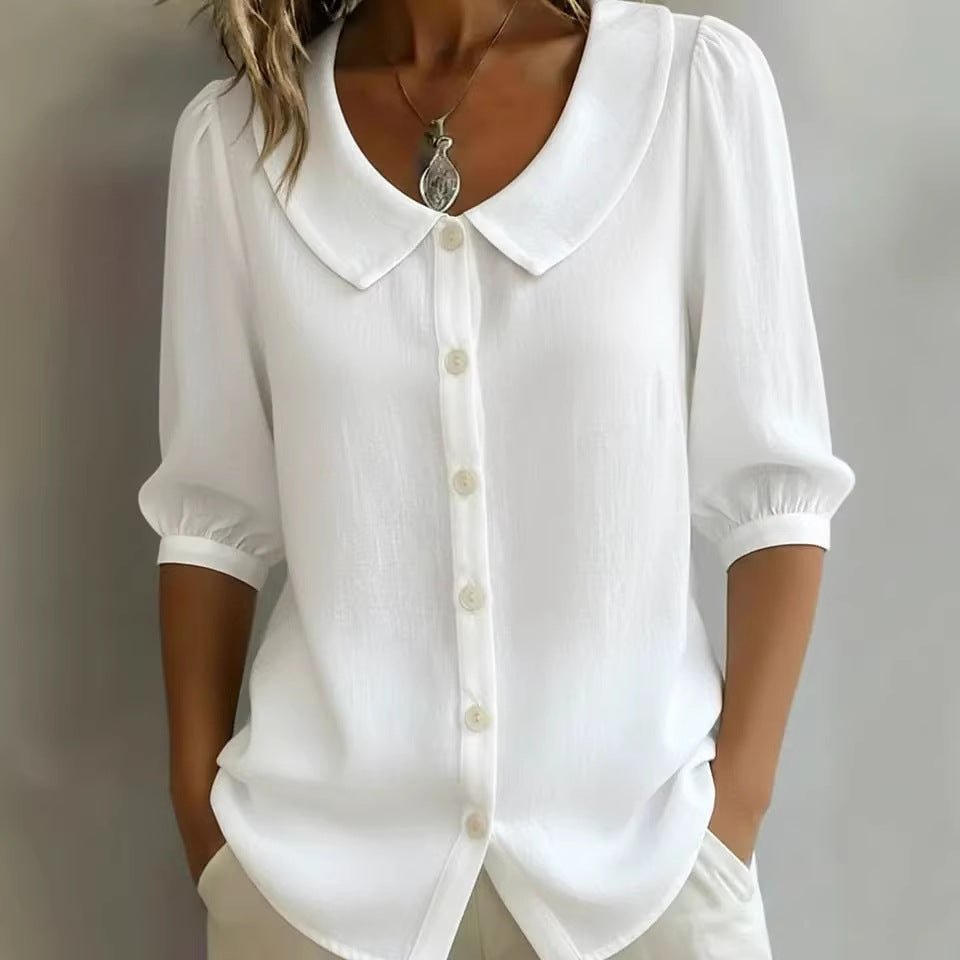 Front view of the white collared blouse with buttons and short sleeves, chic minimalist style.