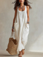 Lifestyle shot of a flowy white long slip dress with pockets, elegant minimalist style @Black#White