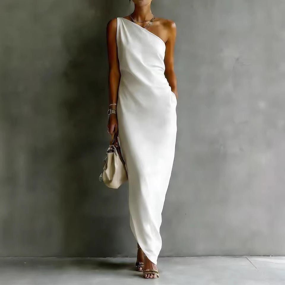 Flowy white satin off-shoulder dress, elegant draping design for chic occasions