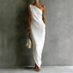 Flowy white satin off-shoulder dress, elegant draping design for chic occasions