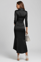 Back view of a long black satin dress with long sleeves and a V-neck, highlighting elegant design in studio