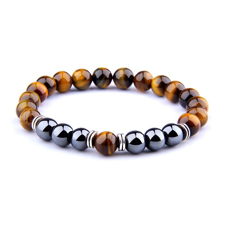 Detail close-up of the yellow tiger eye bracelet with a beaded design and elastic band.