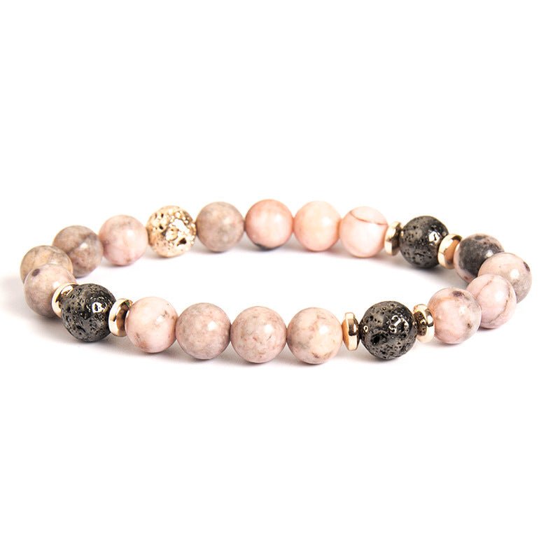 Detail close-up of pink zebra stone bracelet featuring beaded design and natural stones.