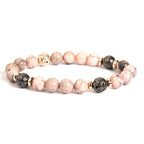 Detail close-up of pink zebra stone bracelet featuring beaded design and natural stones.