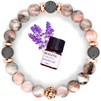 Lifestyle shot of pink zebra stone bracelet surrounded by lavender flowers, highlighting chic fashion.