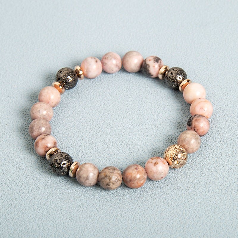 Side view of pink zebra stone bracelet emphasizing beaded design and natural stones.