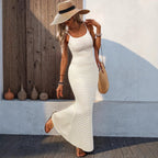 Chic black and white striped knitted slip dress, sleeveless maxi style for a minimalist look.