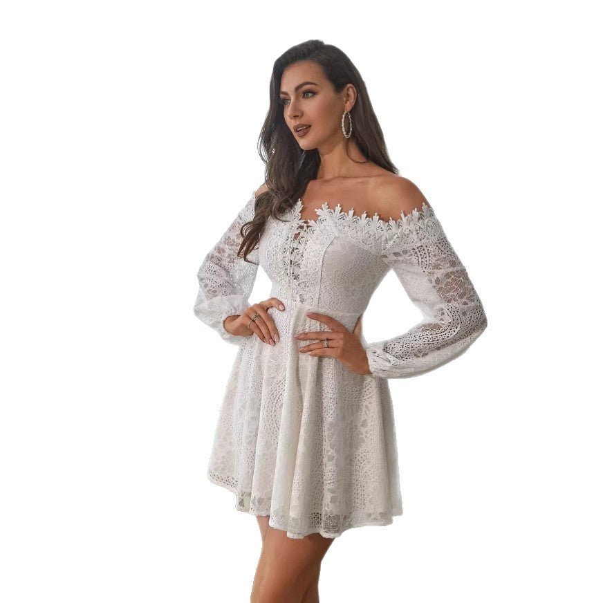 Side view of a white hollow-out off-shoulder dress with long sleeves, showcasing its elegant design.