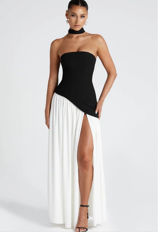 Front view of the black and white irregular tube top maxi dress showcasing its chic silhouette and tied waist.
