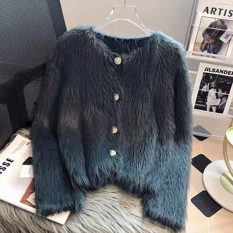 Front view of a dark blue knitted cardigan with button closure and textured fabric.
