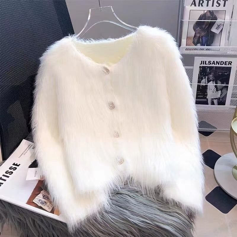 Front view of a white knitted cardigan featuring button closure and fluffy texture.
