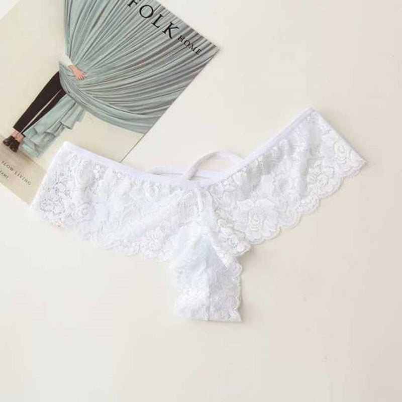 Packaging of white lace thong panty, featuring lace material and included tag, top view