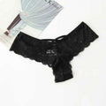 Packaging of black lace thong panty, showcasing lace material and included tag, top view