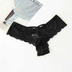 Packaging of black lace thong panty, showcasing lace material and included tag, top view