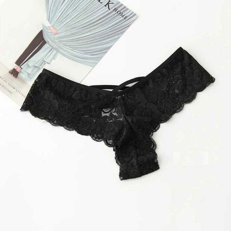 Packaging of black lace thong panty, showcasing lace material and included tag, top view