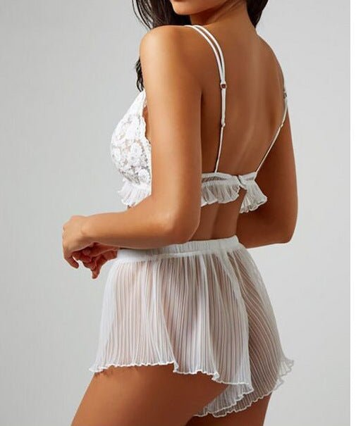 Back view of a white lace lingerie set with lace detailing and a bow tie accent.