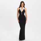 Front view of a black sleeveless evening gown featuring a lapel halter neckline and form-fitting silhouette.