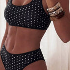 Detail shot of the leopard print two-piece swimsuit featuring high-waisted design and braided straps.